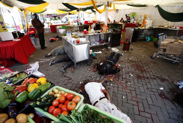 Bodies are seen at the Westgate shopping center. (Photo by Goran Tomasevic/Reuters)