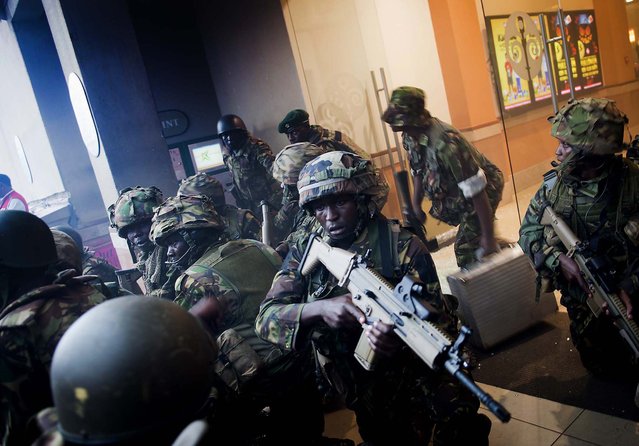 Armed police leave after entering the Westgate Mall. (Photo by Jonathan Kalan/Associated Press)